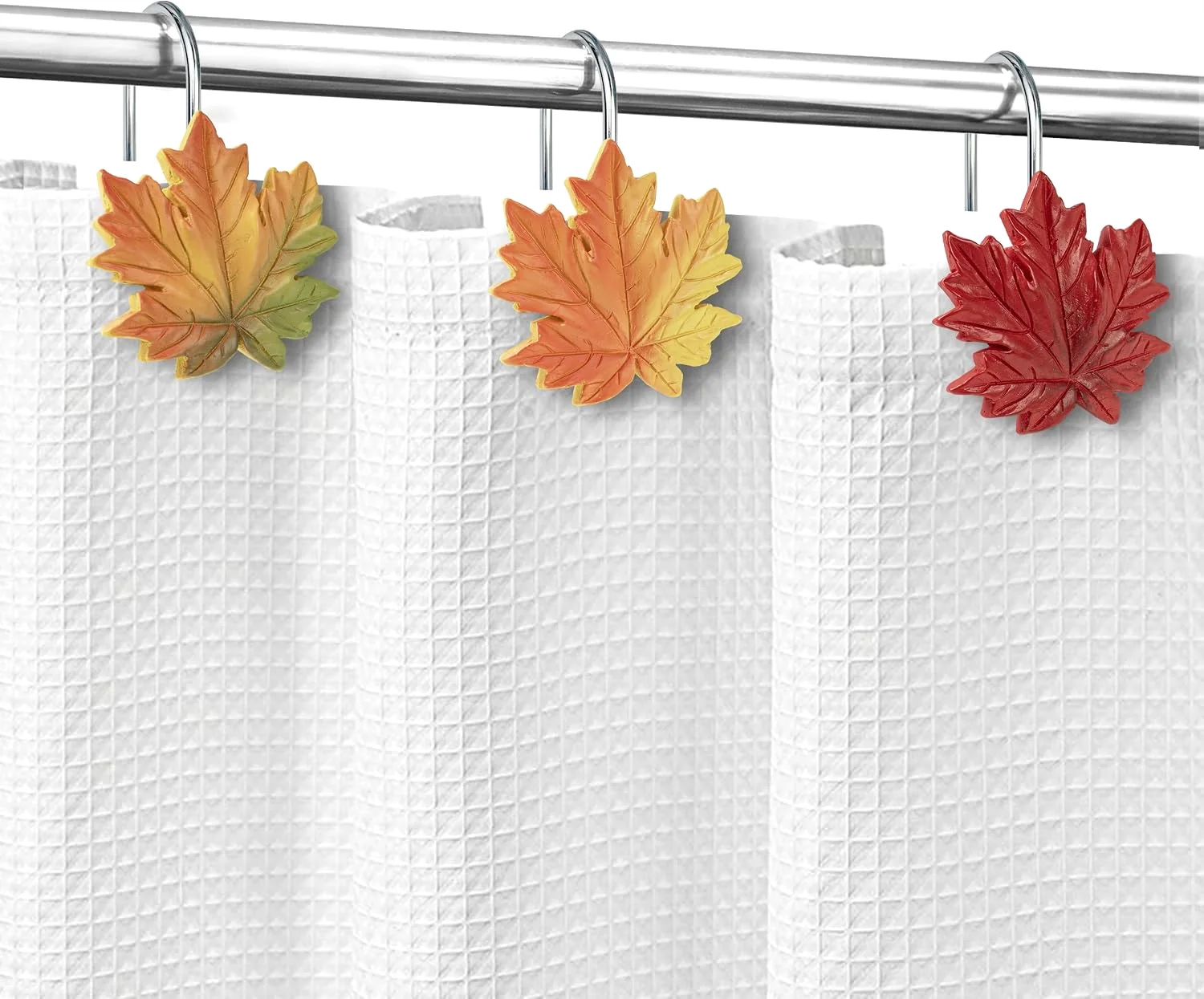 Sunlit maple leaf shower curtain hooks on a rod
