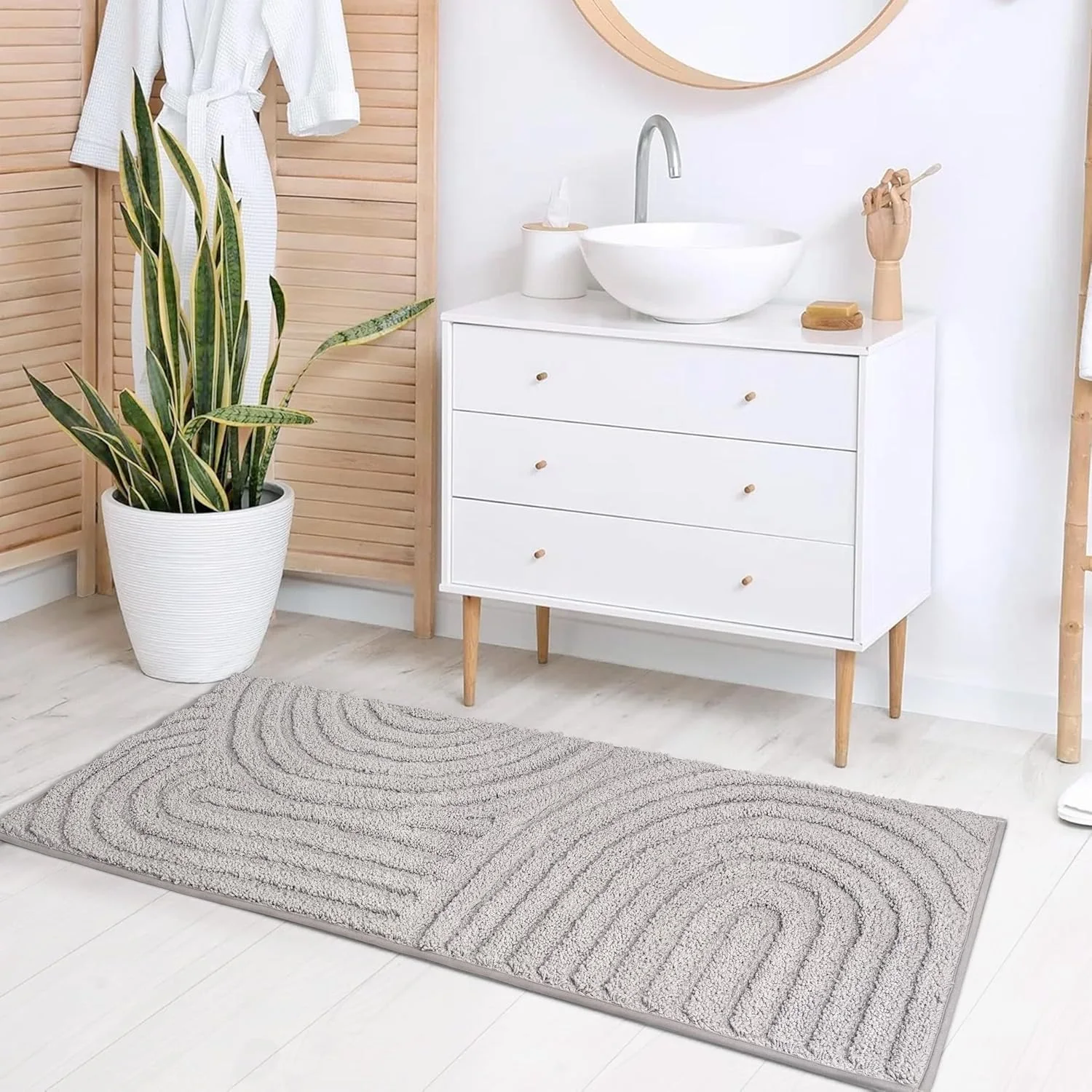 A Sunlit textured bath runner on a bathroom floor