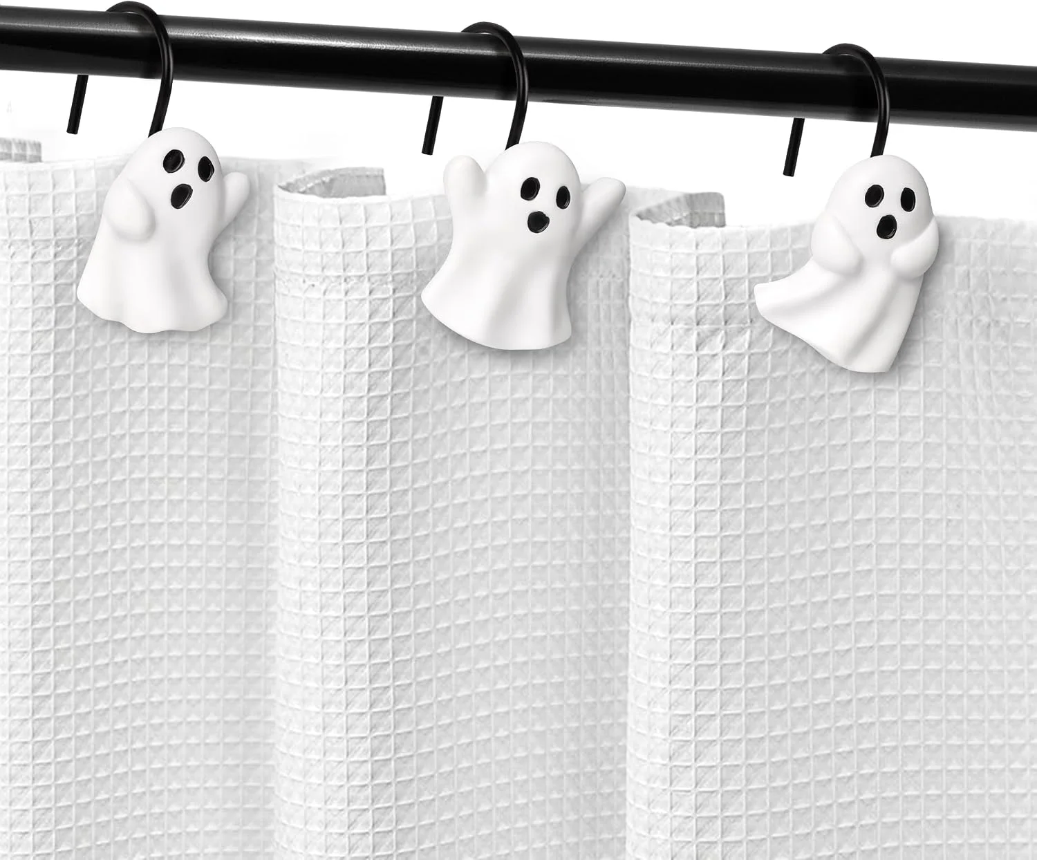 Sunlit shower curtain hooks on a rod